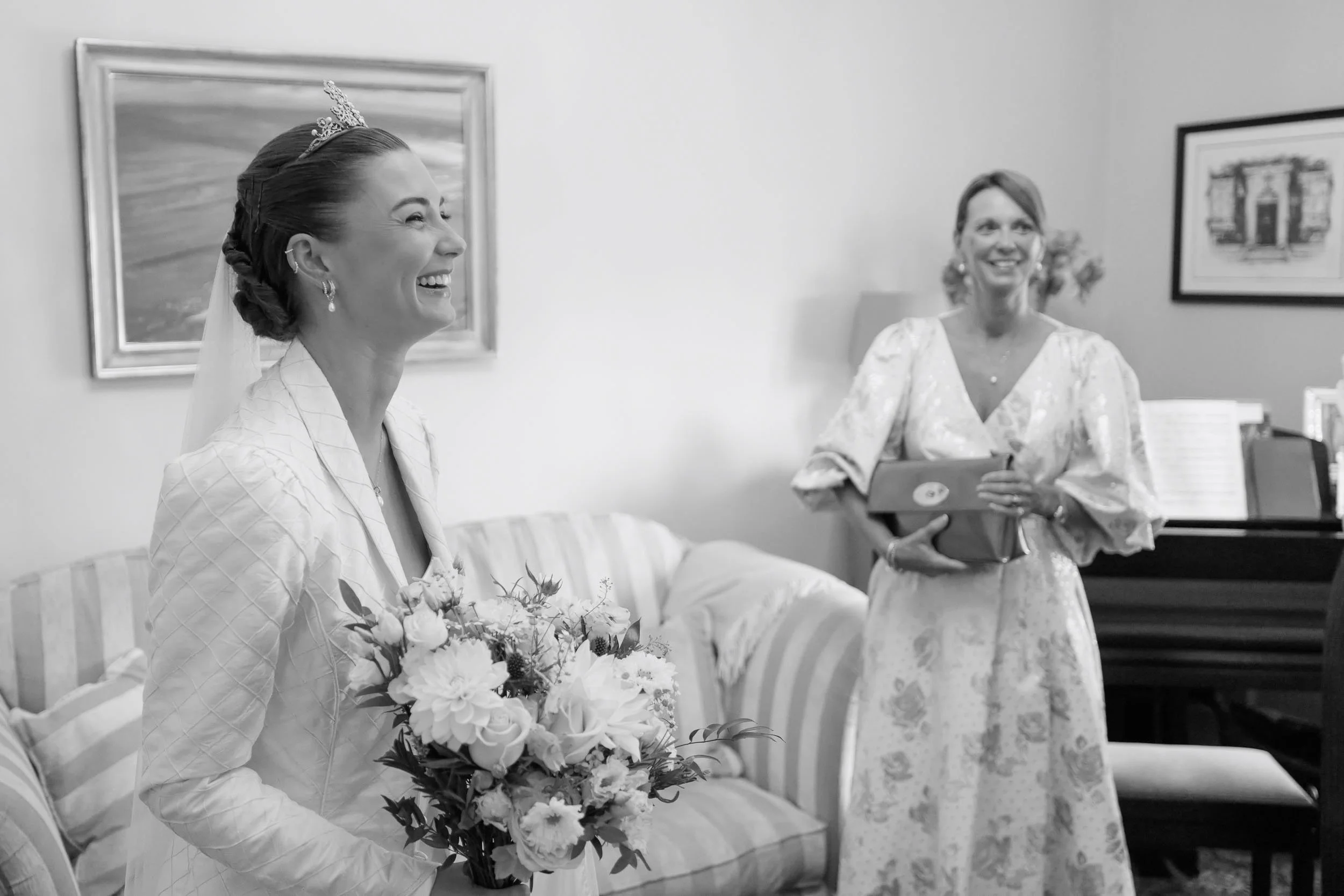 Alicia laughing in a black and white bridal photograph before her wedding at York Minster.