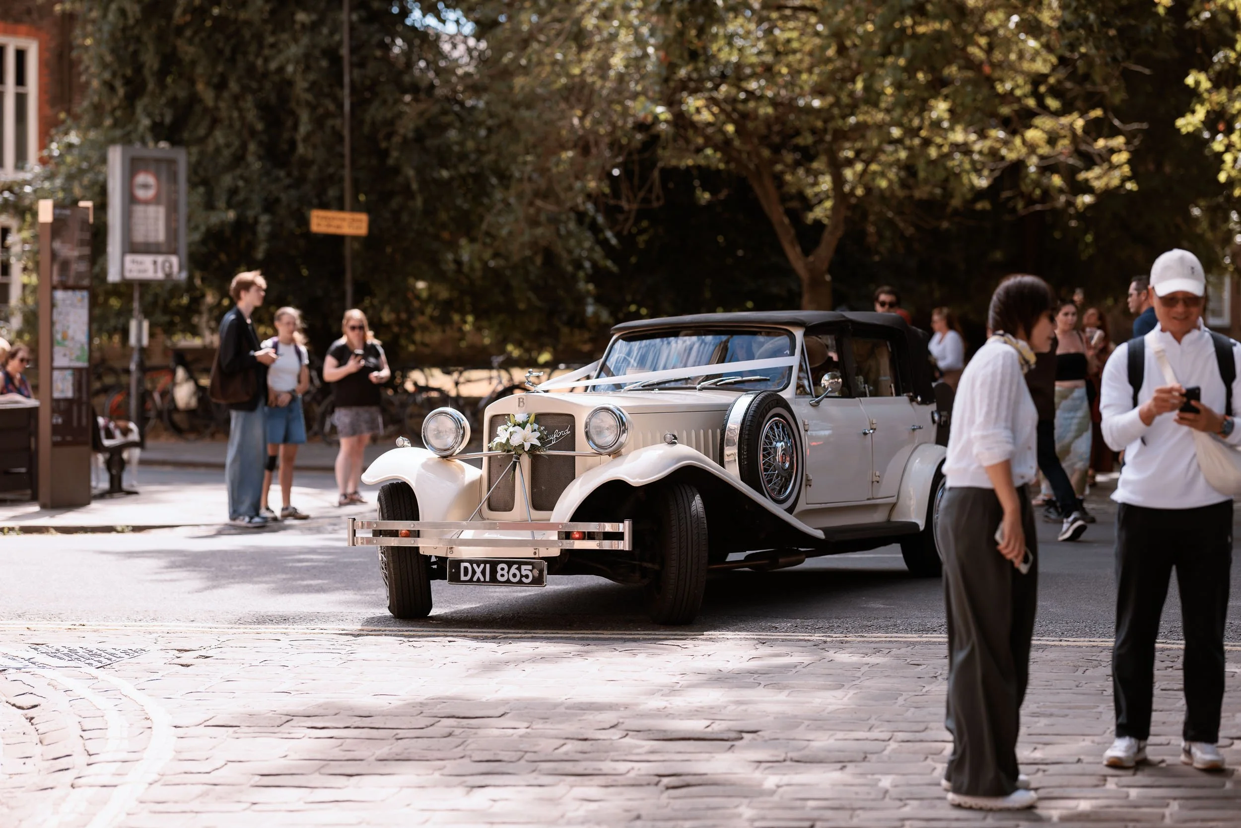 Alicia travelling to York Minster in a vintage wedding car.