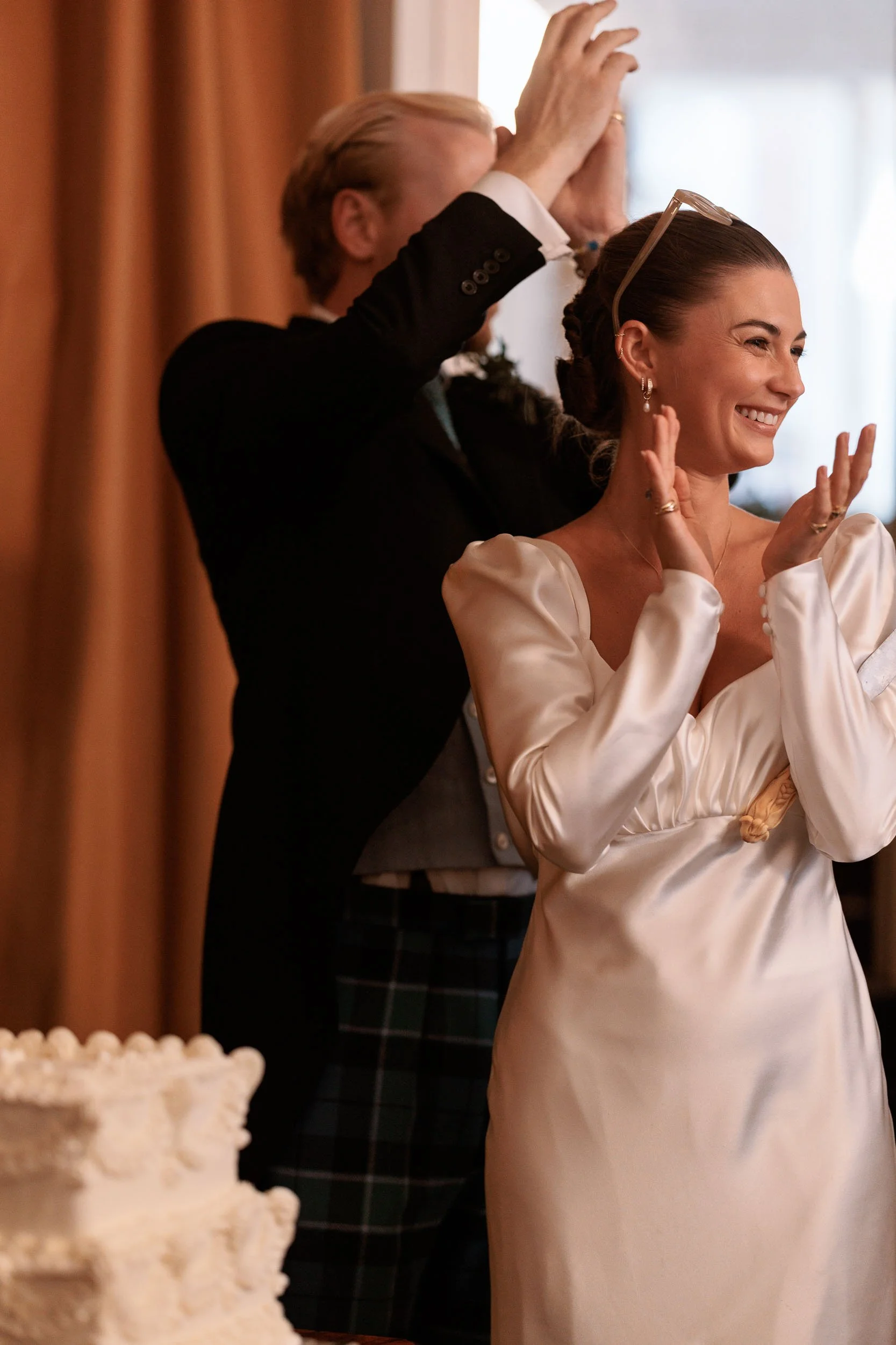 Alicia and Max cutting their wedding cake.