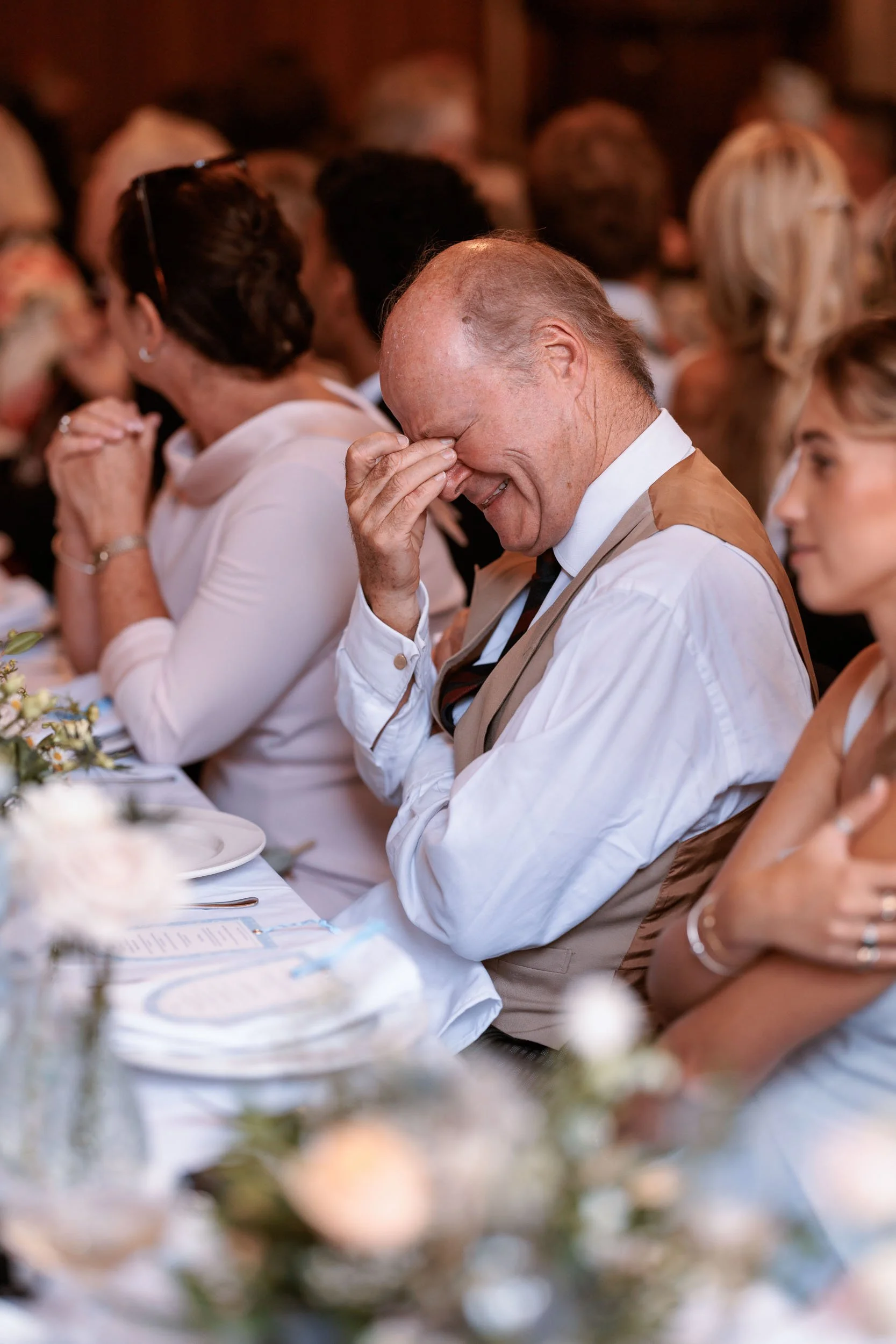 Emotional reaction during the speeches at Alicia and Max's wedding reception.