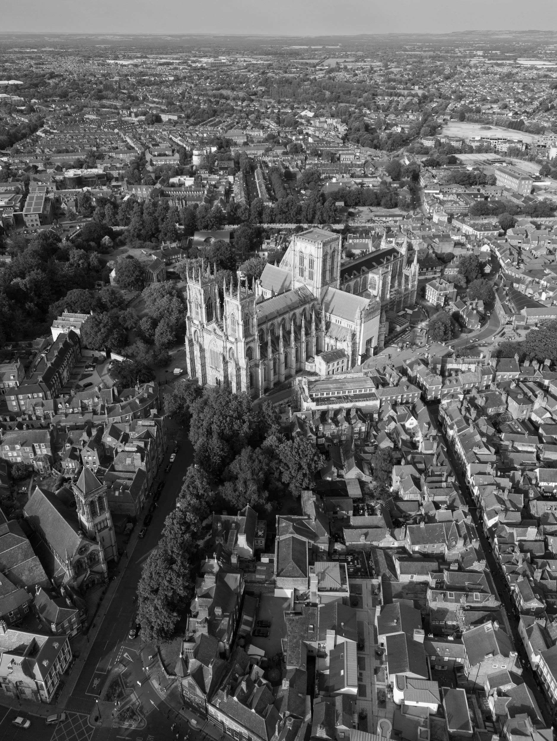 Black and white aerial view of York Minster and the historic city of York.