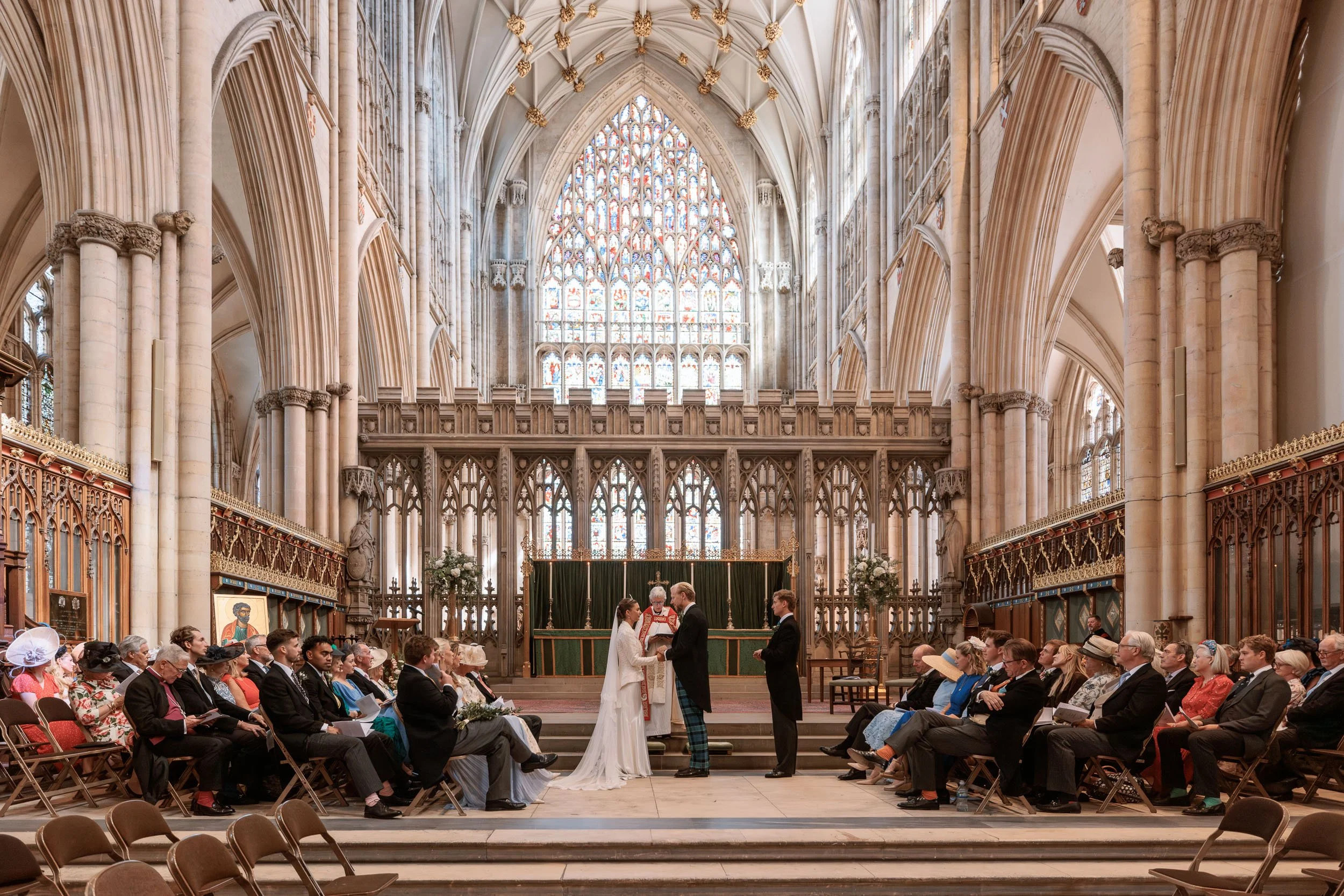 Wide view of Alicia and Max's wedding ceremony inside York Minster.
