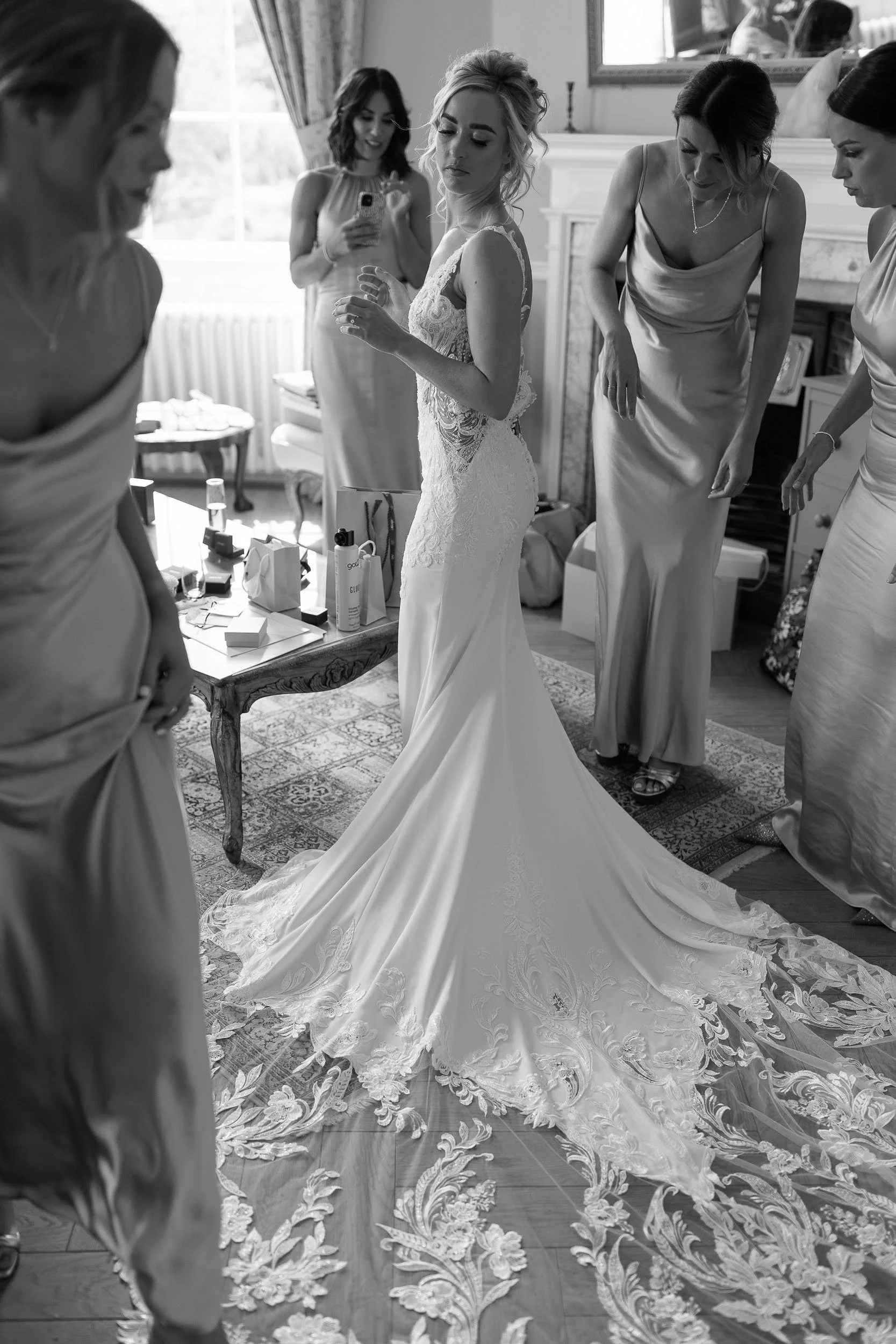 Black and white photograph of a bride getting ready at Middleton Lodge.