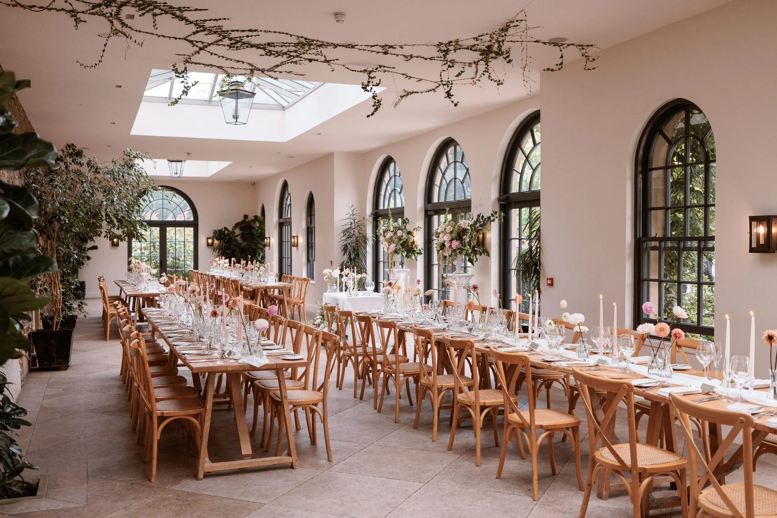 Wedding breakfast tables prepared inside the Fig House at Middleton Lodge.