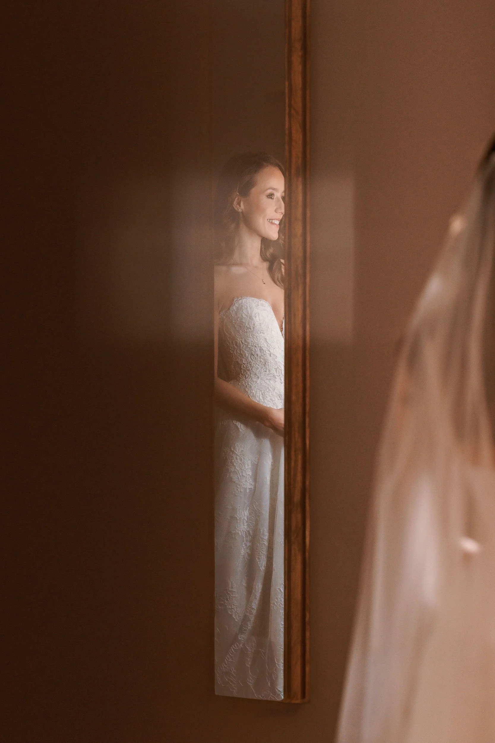 A artistic bridal portrait, in the mirror of the bridal suite at a Rudding Park wedding in Harrogate. 