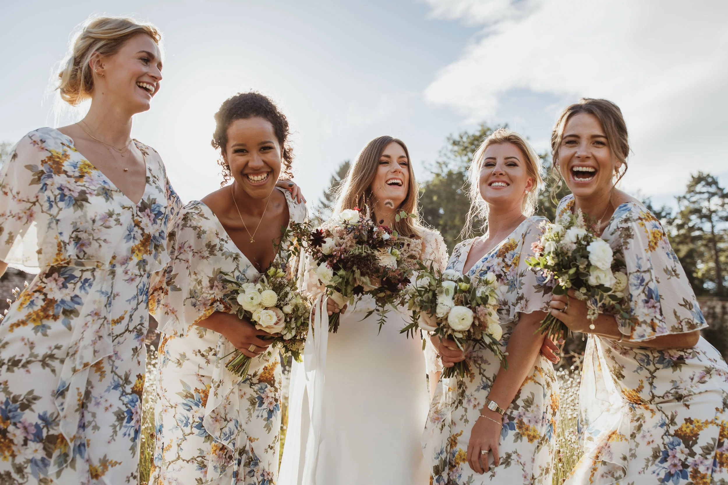 Bridesmaids laughing together during a wedding at Middleton Lodge.
