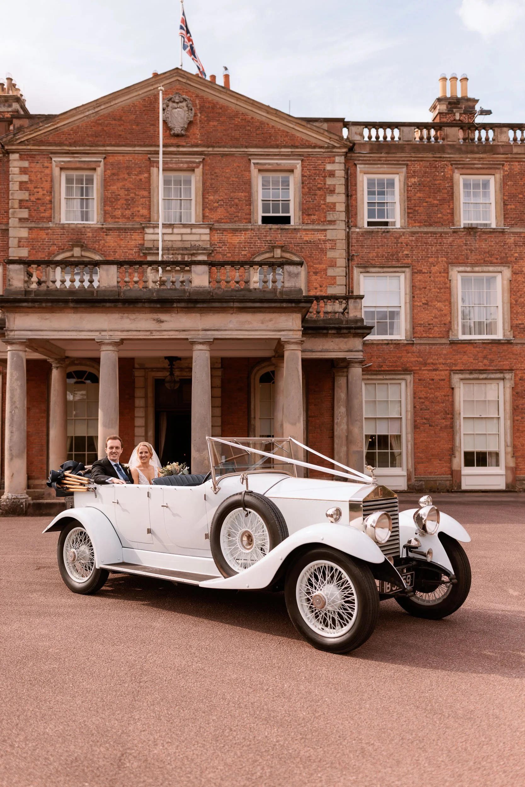Bride and groom photographed in the grounds of Weston Park, a historic country estate in Shropshire.