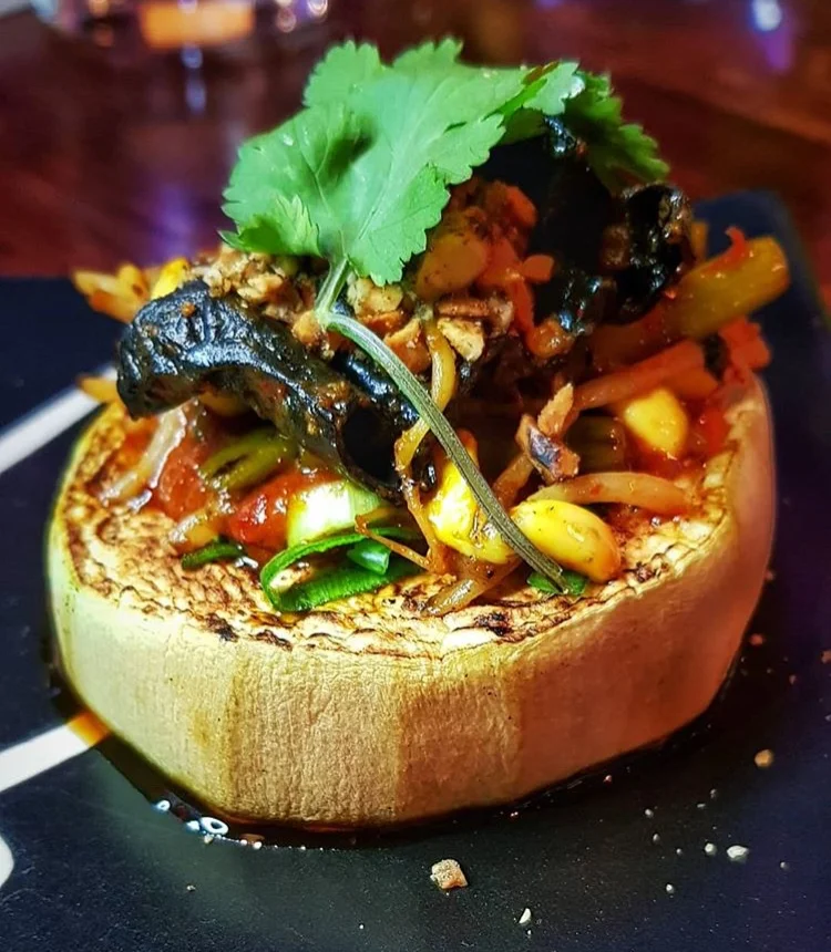 Grilled eggplant, ‘Fish Fragrant’ YuXiang gravy, garlic shoots, soybean shoots and wood ear.