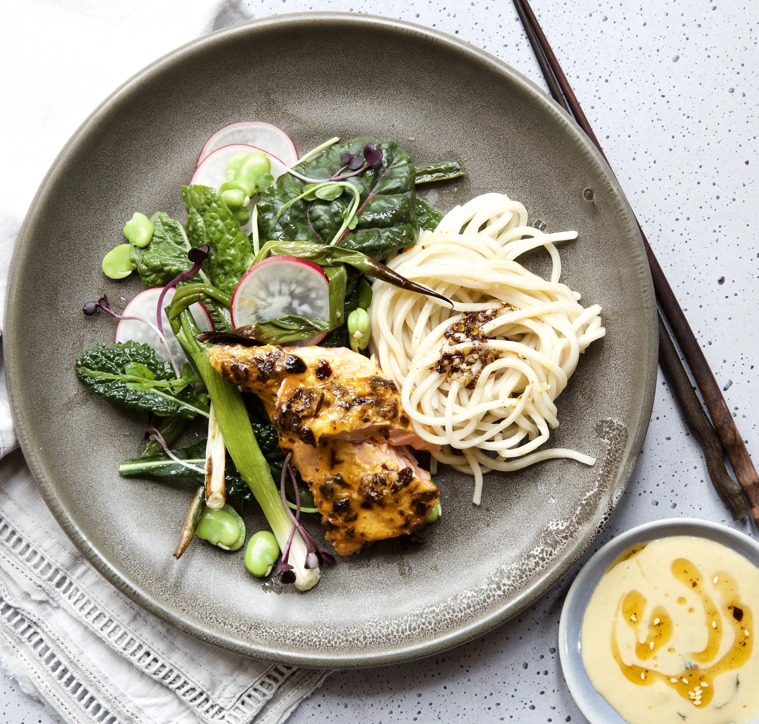 CHILLI CRUNCH BAKED SALMON WITH SPRING GREENS AND MISO NOODLES