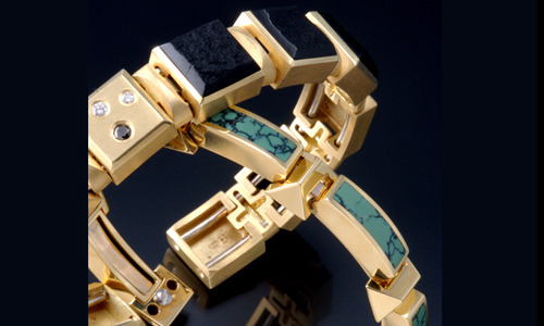   18K yellow gold spring bracelets in natural surface black jade and polished chinese turquoise.     