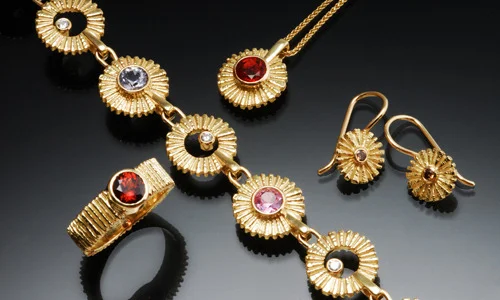   18K yellow gold, precious and semi-precious stones in this grouping from the Riga Collection  