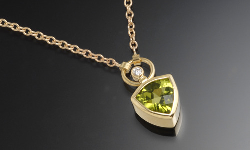   14K yellow gold necklace with 6mm peridot and diamond accent  