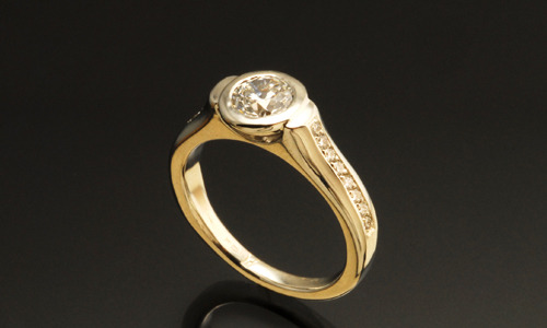   Engagement ring in 14K gold and diamonds. Band width approximately 0.15" 
 Please feel free to contact us for center stone options  