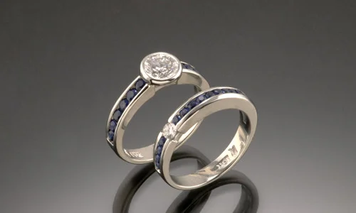  Engagement ring and wedding band 18K white gold, blue sapphires and diamonds. Each width approximately 0.2"     