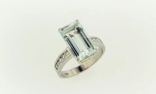  Engagement ring in 18K white gold, sapphires and aquamarine. Band width approximately 0.15" 
 Please feel free to contact us for center stone options  