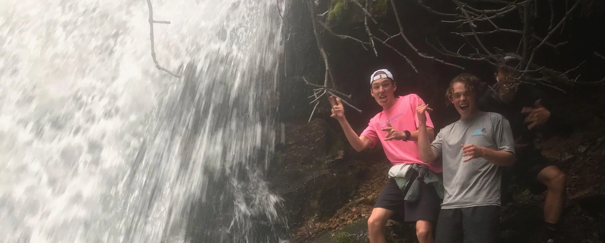 Ted, Kaiden, and Jackson behind the waterfall