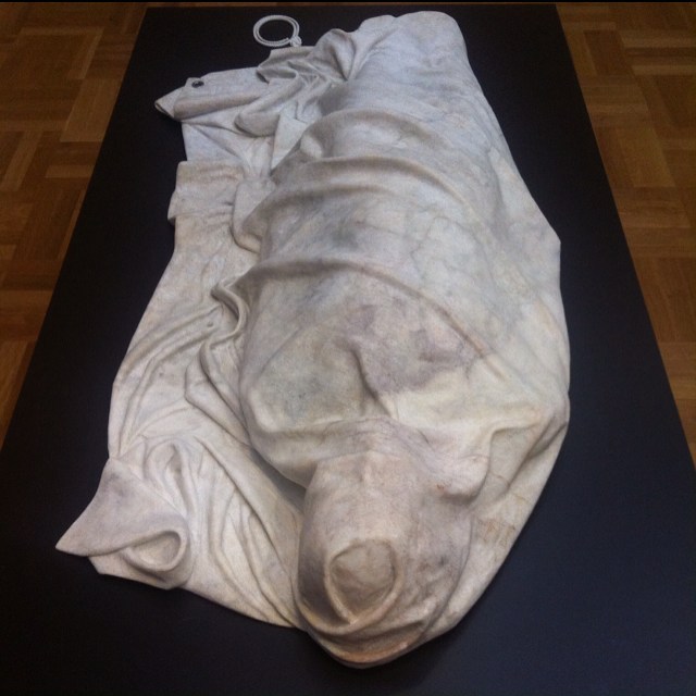 Alex Seton - Marble Sculpture.
My concerns will outlive yours. From
the exhibition "Flags".
Flag meditates on the national flag. It included a series of carved marble flags, some hanging and some folded, and a cloth Australian flag without 