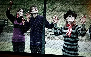 Blow-Up Mimes like animals in a cage they observe and wait.
