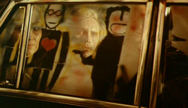 Toby Dammit The limousine taking Toby from the airport to the hotel presents a parade of images including some violent graffiti with a gun and a heart that we see on the glass reflection.
