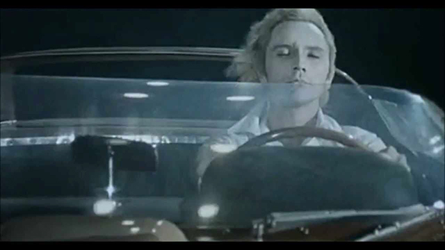 Toby Dammit Toby driving full speed in his new Ferrari and remaining in the same spot without moving at the same time - the nightmare of the modern condition. Note the blackness than envelops the car is perfectly even, as it would be on a stage.