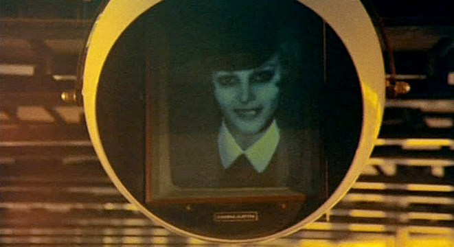 Toby Dammit The modernist video globe - in the form of an eye - contains what looks like an old black and white photograph in a conventional frame with a caption we can't read. Orwell's television that looks back at you comes from the past with an apparently friendly face - modern technocracy at its most insidious.