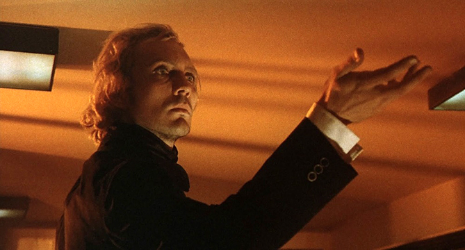 Toby Dammit The formal gesture of a Restoration dandy meeting a familiar nemesis. Notice the dramatic expressionist lighting on the ceiling that is inconsistent with the interior of an airport, but appropriate for Shakespeare - or Poe.