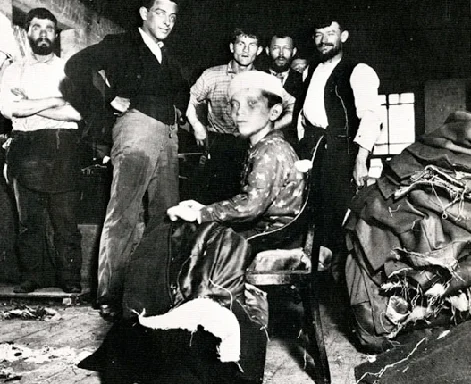 Twelve Year Old Boy Pulling Threads in a Sweat Shop , 1889 Jacob Riis