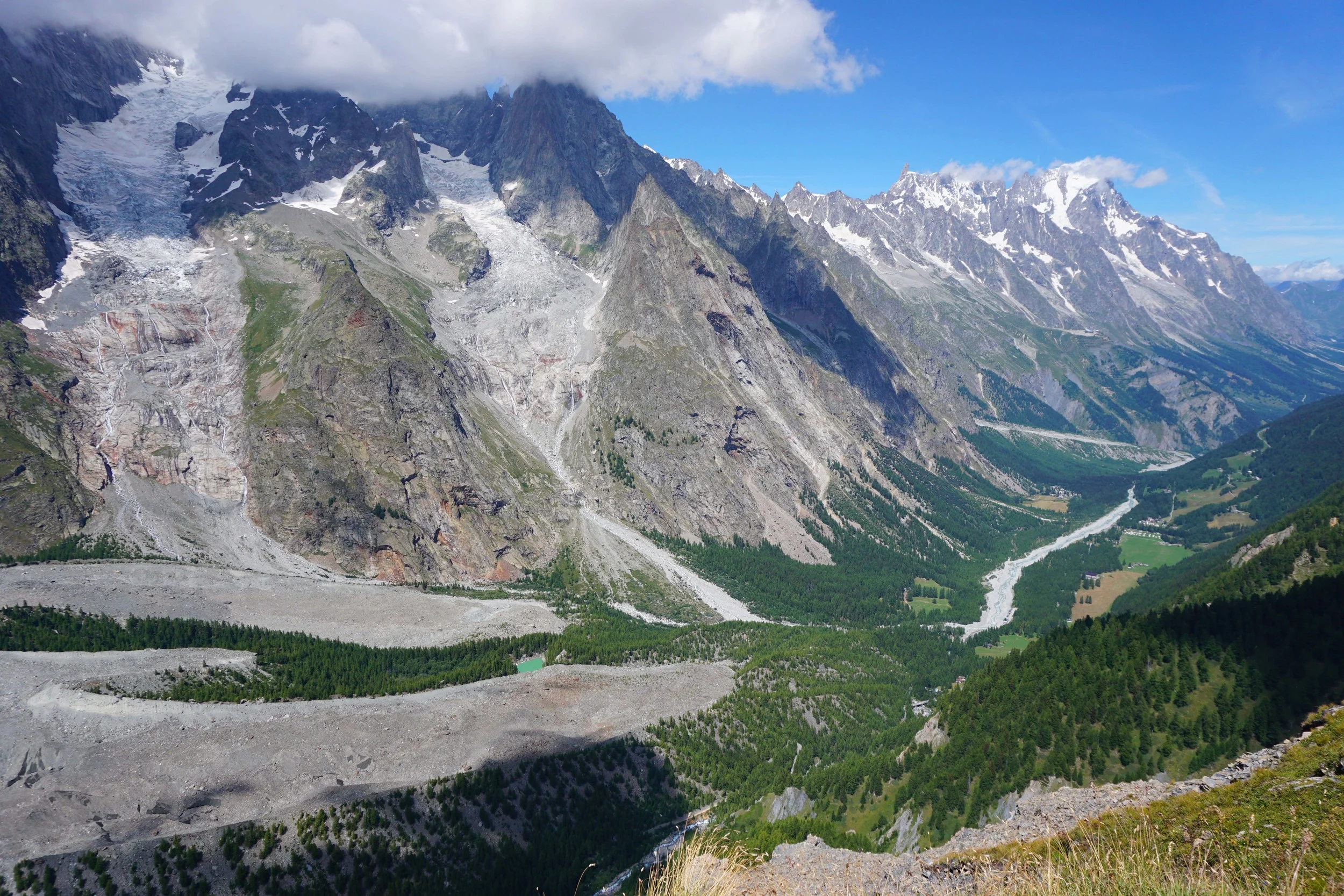 Val Veny. Our campsite was down on the valley floor next to the green meadow.