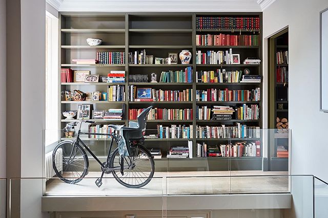 Family life #interiordesign #design #huxleyhome #paintandpaperlibrary #bookcase #bike #books #interiors Queens Park, NW10