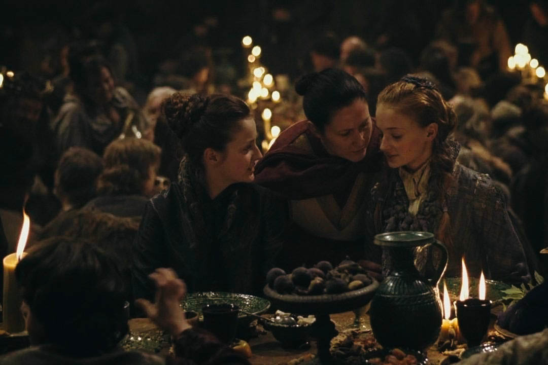 Sansa Stark at a feast (of deceit and cruelty!), in Game of Thrones.
