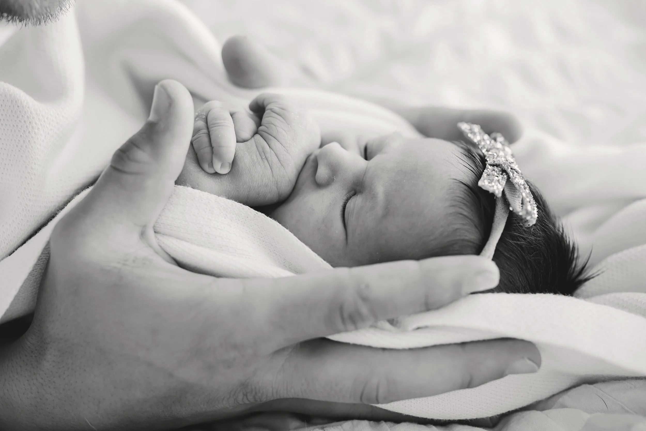 baby in dads hands