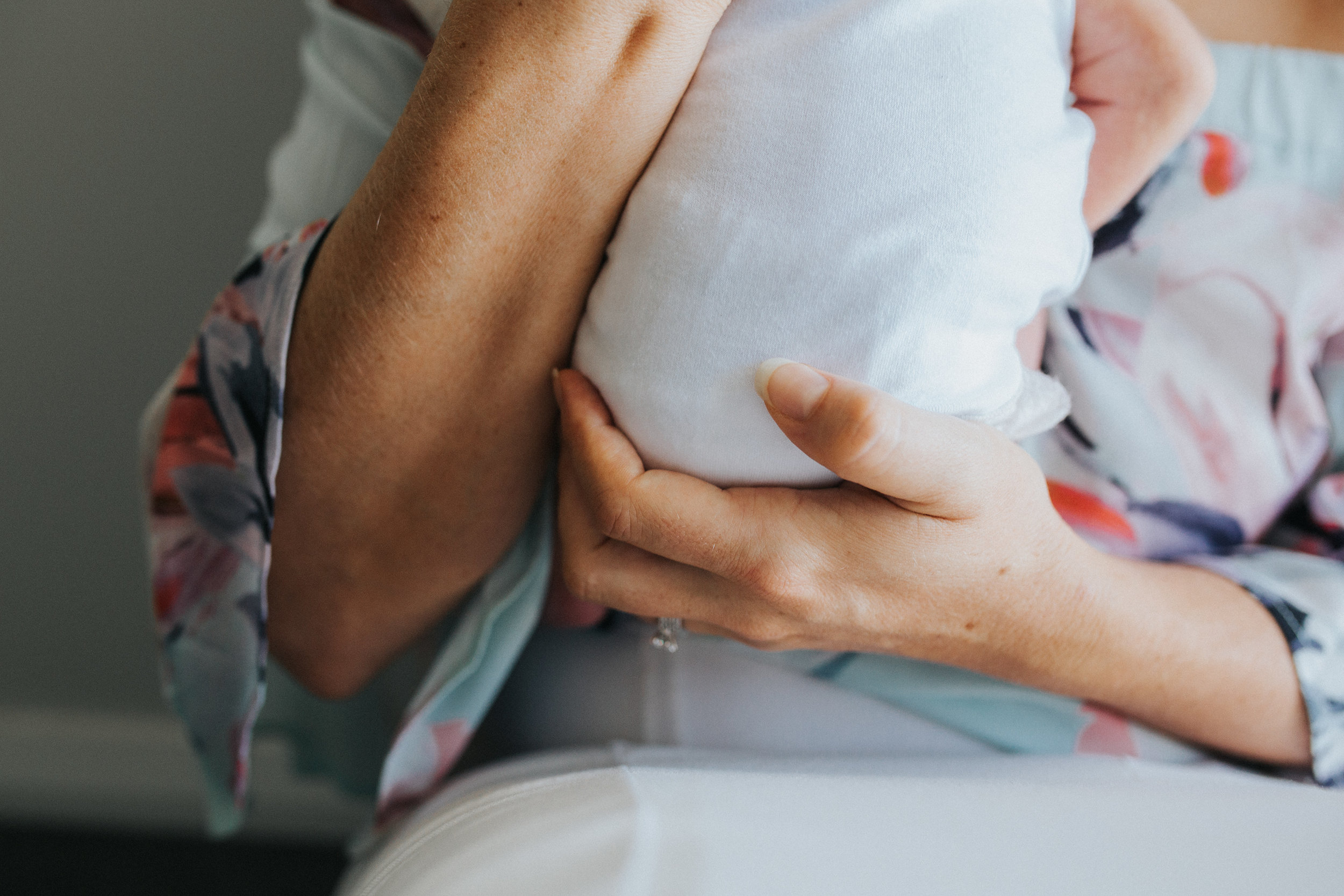 tiny baby in mums hands