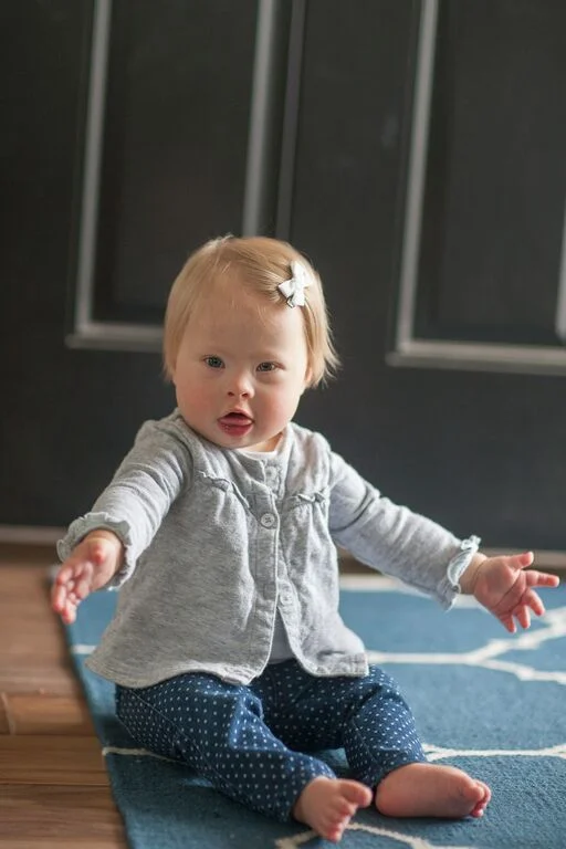 When I think about what the last year has been like getting to know Hannah, the thing that sticks out most is Hannah's spirit being so full of sunshine! She is the happiest, most content little person. Her smiles and soft giggle light up the room. She has been such a wonderful addition to our family and is a constant reminder that despite the tough circumstances we run into in our lives, there is always so much to smile about.