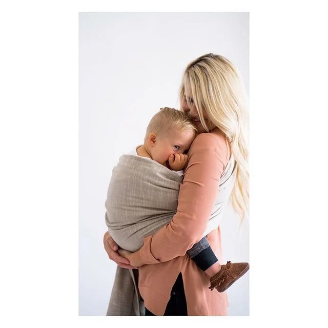 One of the things I love about having a child with DS-- enjoying the baby phase a little longer. Sure, there are some cons to that-- spoon feeding, longer to walk, communication skills, etc... But how many almost-three-year-olds will just sit and snuggle you? Gaze into your eyes like you're their world? Wake up and reach for you, burry their head into your neck, melt into your arms and then stay there for long periods? 💙 I loved carrying him in the sling and snuggling his cream puff little body during our @mywildbird shoot. Can't wait to get my own. #blessedbyds #mywildbird #nothingdownaboutit