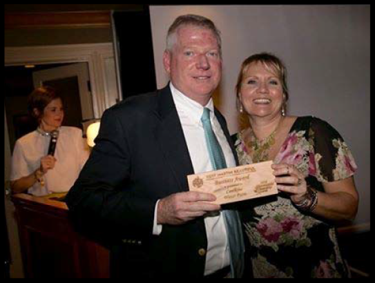 Melissa Corbett, Engineer for Caulkins Water Farm, receiving the Business Award from Kevin Powers, SFWMD Governing Board Member, at the 2016 Keep Martin Beautiful Environmental Stewardship Awards.