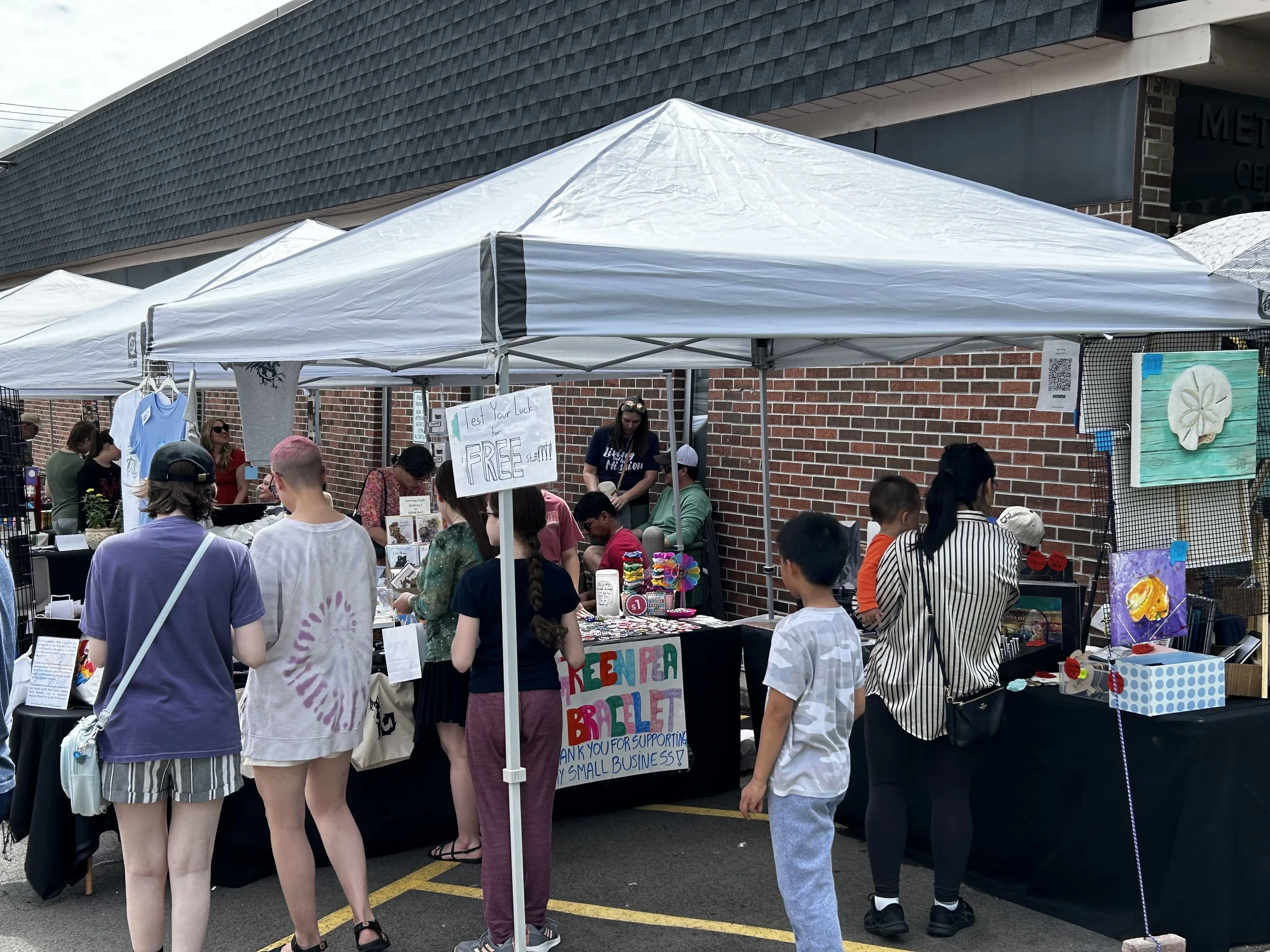 Kids Art Alley - Booth set up with customers 1.jpeg
