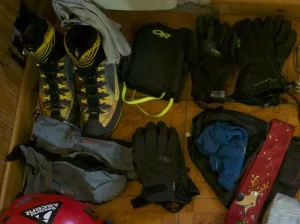 The sets of gloves I brought on Excocet. Ignore the other stuff in the photo, except the Christmas tie, that was another important piece of kit. The blue mitten shells are on the left.