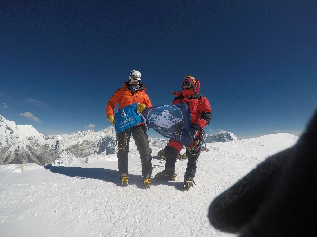 Kim and Phurba on the summit of Ama Dablam. (Photo credit: Kim Couri).