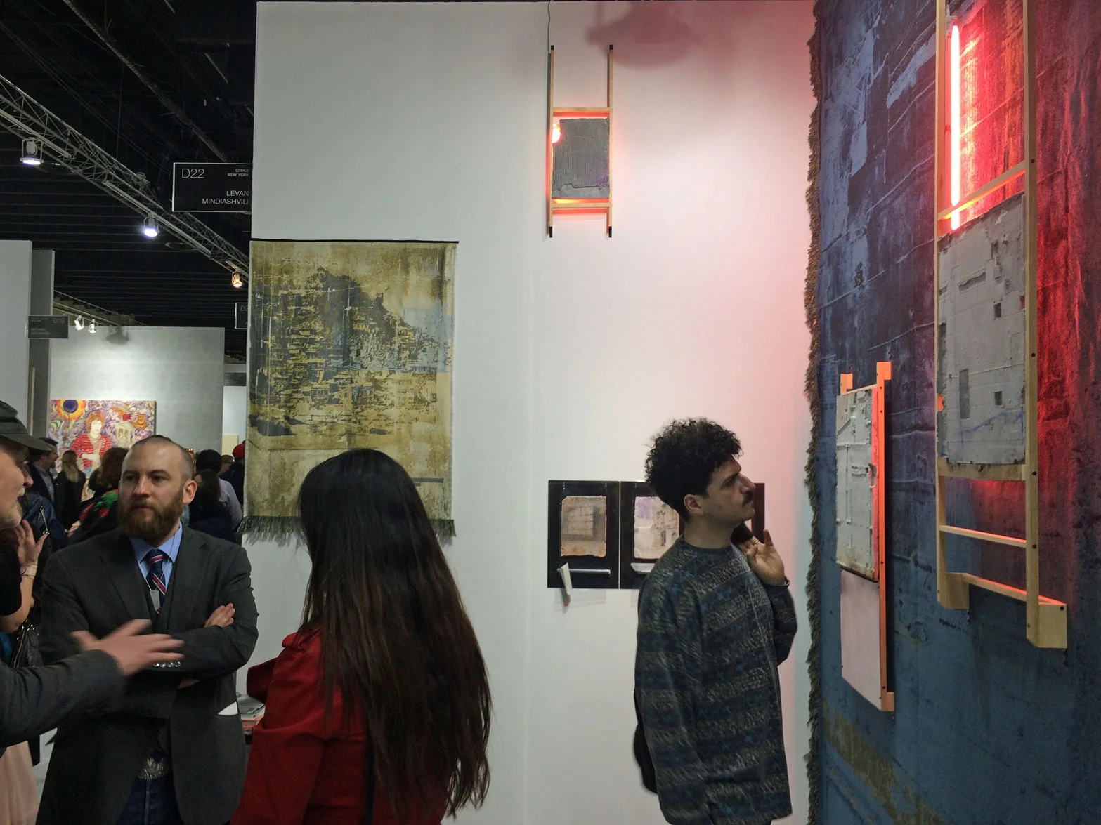 Jason Patrick Voegele of Lodge Gallery in front of work by Levan Mindiashvili, The Lodge Gallery, New York, NY