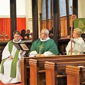  Revd Sarah Hildreth-Osborn (LEFT), LGBTQIA+ Chaplain for the Diocese of St Asaph, north-east Wales, with Right Revd Bishop Gregory Cameron (CENTRE) at the celebration service to launch the Chaplaincy 