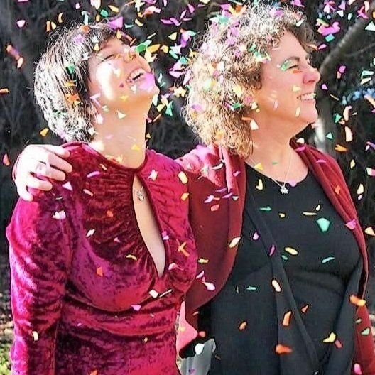  Wendy Young and her wife as they married in December 2014. Wendy and her new wife look up with joy as confetti falls around them.  READ MORE . 