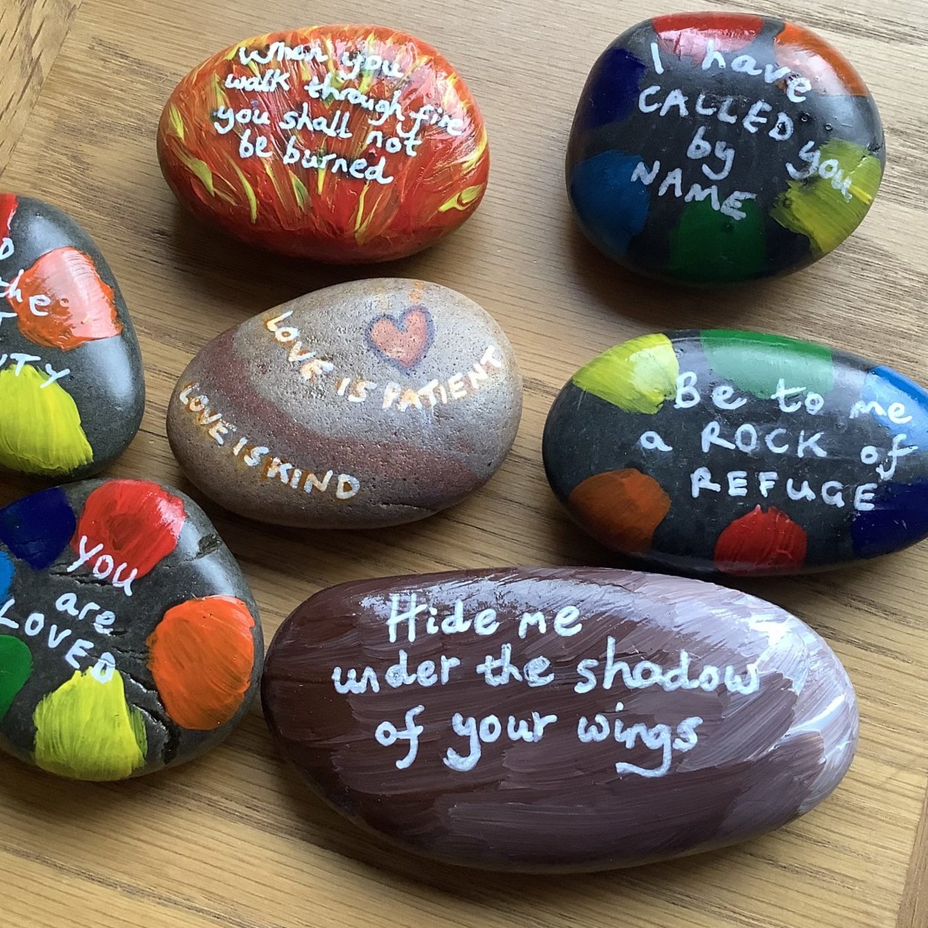  Members of the Open Table Cambridge community painted affirming messages on pebbles to decorate the church during LGBT+ History Month, which they placed around the centre of Cambridge for people to find.  READ MORE . 
