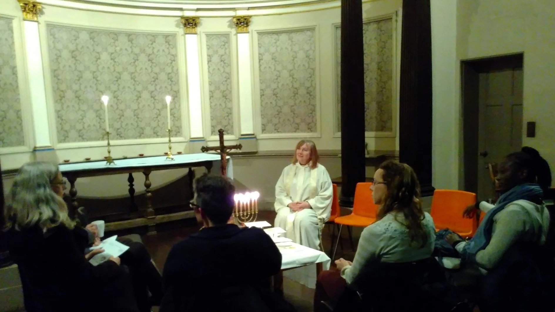  Revd Anne Bennett [seated in white] at the first Open Table Blackheath gathering in January 2018. Anne is vicar of the  Church of the Ascension  Blackheath which hosted an Open Table community since 2018. Anne campaigns for equal rights, especially in the Church of England, having seen first-hand the pain of rejection and the injustice of discrimination in her own family. Anne was one of the founding trustees of the Open Table Network when it became a charity in March 2021. 