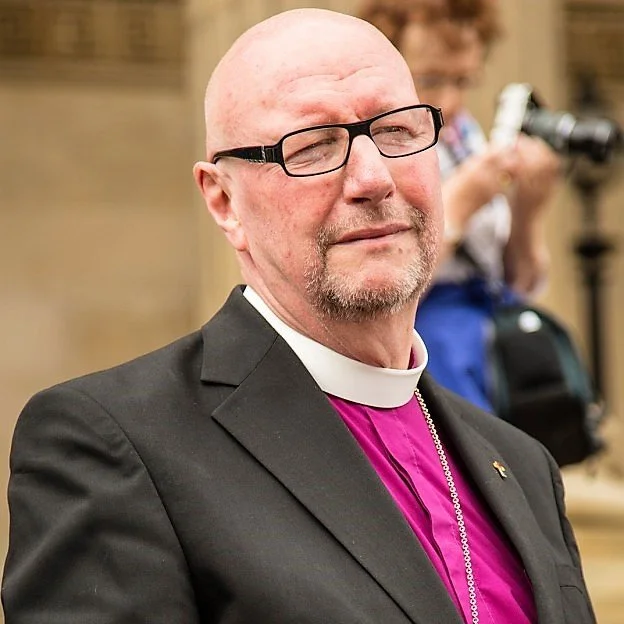   Rt Revd Bishop Paul Bayes at Liverpool Pride 2017, wearing the rainbow cross presented to him by the Open Table community during    his first visit in July 2015   .  