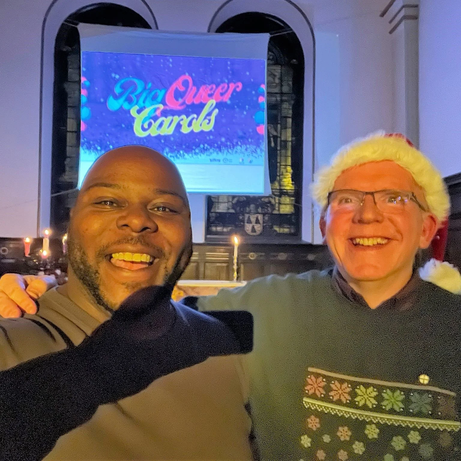 OTN trustee Augustine Tanner-Ihm with Coordinator Kieran Bohan at the Big Queer Carols event at Sacred Trinity Salford on Sunday 18th December 2022. In his introduction to the Salford service, Kieran explained: ‘The word “queer” has been, and sometimes still is, used as a term of insult to many in the LGBTQIA+ community. When we use it to describe an event like this, it is a taking back and reframing of the language used about us. Academics use the word ‘queer’ to mean “breaking false binaries”, and there is even a branch of theology called ‘queer theology’. For example, St Paul wrote: “There is neither Jew nor Gentile, neither slave nor free, nor is there male and female, for you are all one in Christ Jesus.” ‘In our modern context, we might add the binaries that we are called to challenge: neither black nor white, neither able nor disabled, neither gay nor straight, neither transgender nor cisgender... you might think of your own. ‘Jesus often broke the binaries and boundaries of his culture, causing scandal by eating with tax collectors and other outcasts. As LGBTQIA+ people who have often been outcast in our communities, to “queer” our theology is to engage with how we talk about God and the Bible from a point of view that isn’t mainstream, male and heterosexual, and to reframe teachings about God and the Bible that seek to denigrate and “other” LGBTQIA+ people.’ READ MORE: What is queer theology?