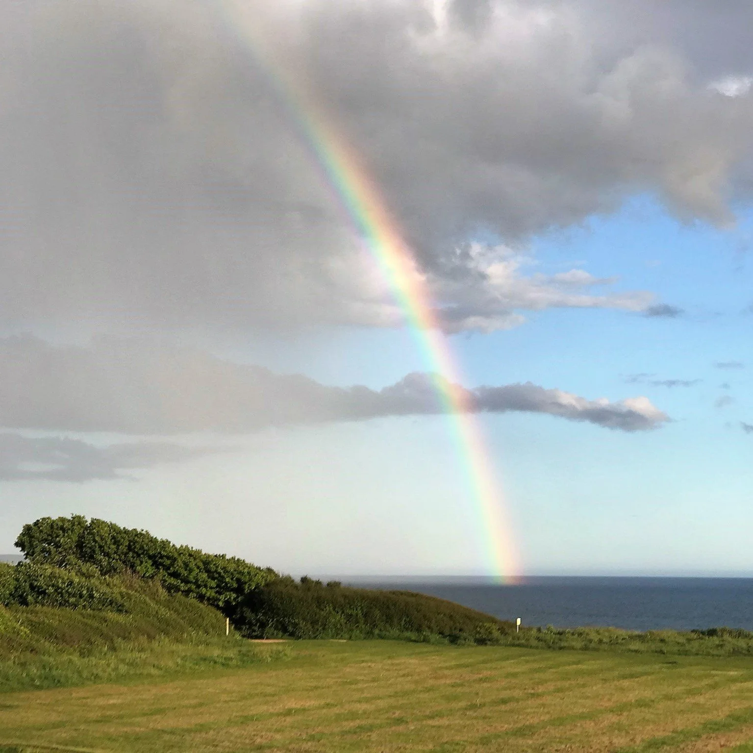 Photo of a rainbow over the sea by Suzanne H, Open Table Chester