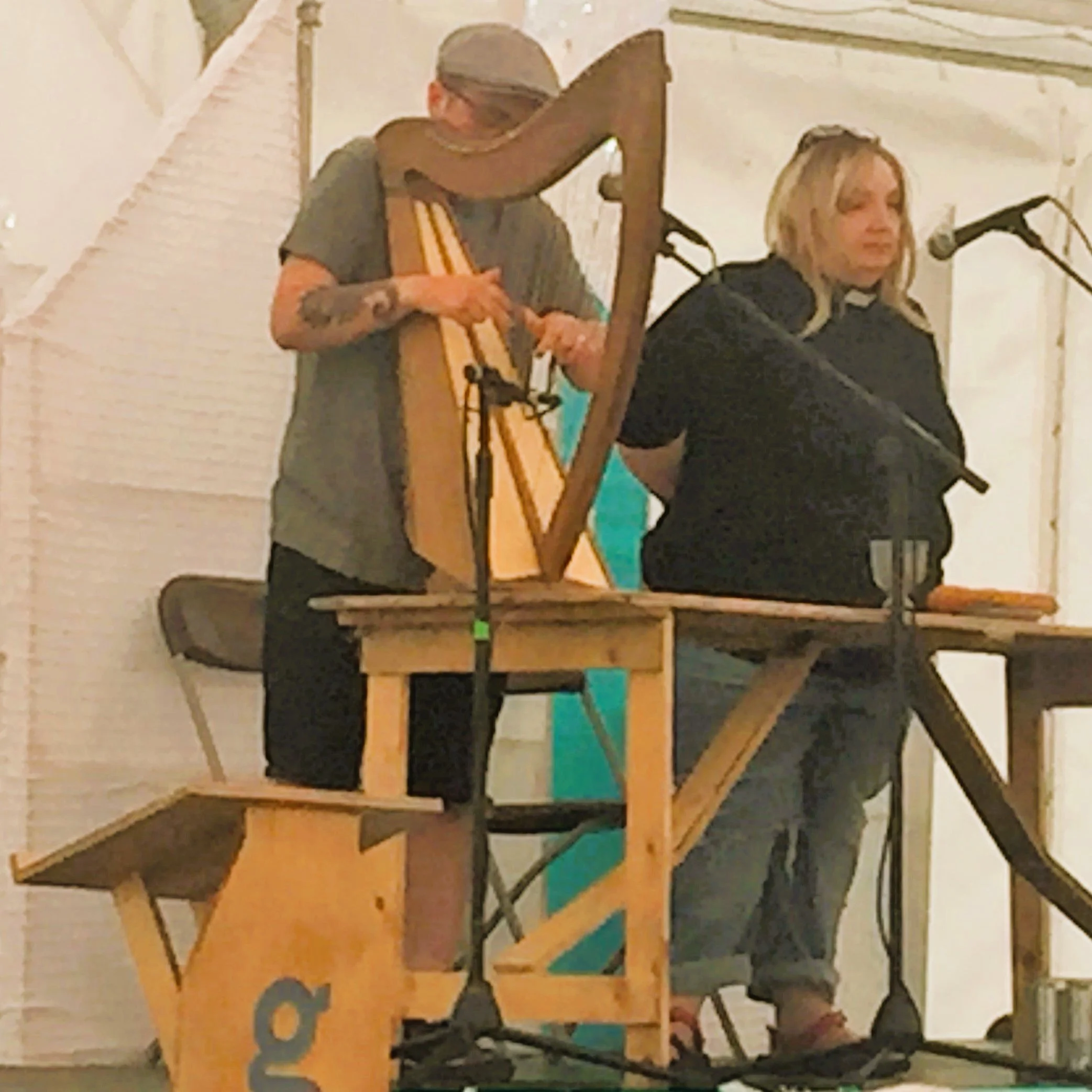  Revds Alex and Jo Clare-Young leading the Greenbelt Quiet Communion - Alex on harp, Jo leading the communion service. PHOTO: Kieran Bohan 