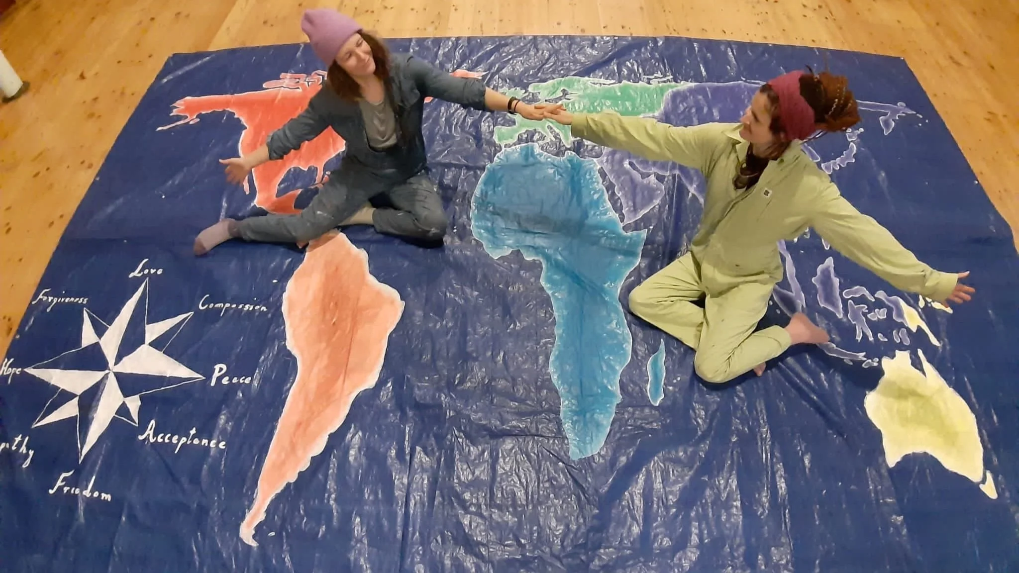 ON TOP OF THE WORLD! Artists Dorota Modlinger and Yolanda Talikowska proudly display the map they created specially for the vigil.