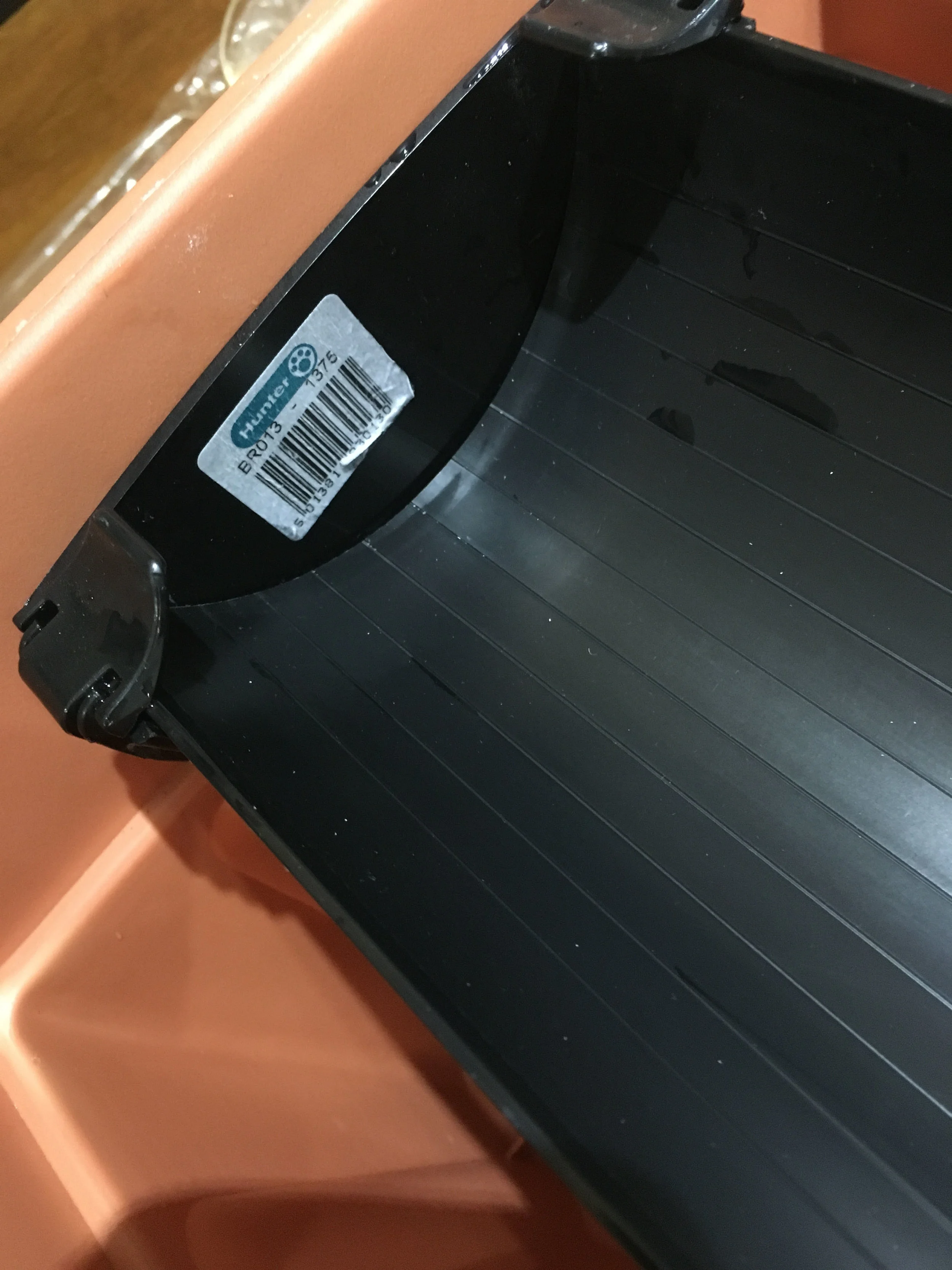 Close up of one of the ends of the gutter, showing the end-cap