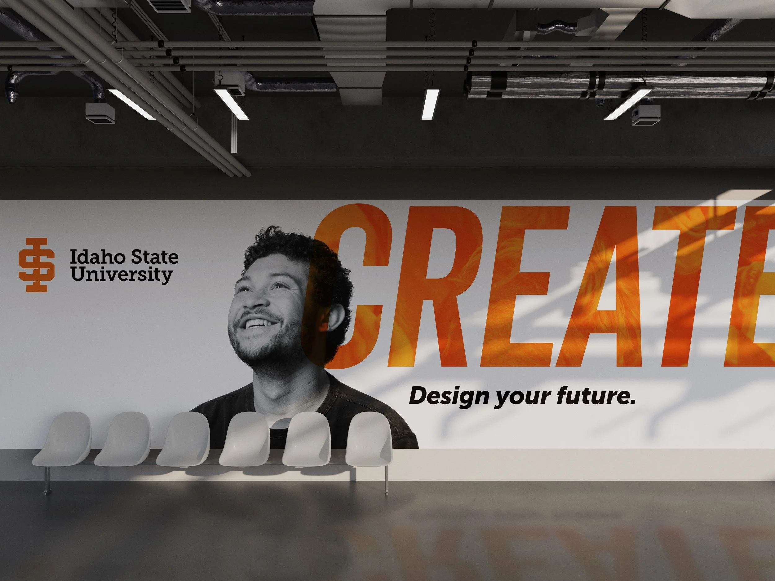Interior of Idaho State University with a large poster of a smiling man, the words 'CREATE' and 'Design your future', and Georgia Tech logo on the wall.